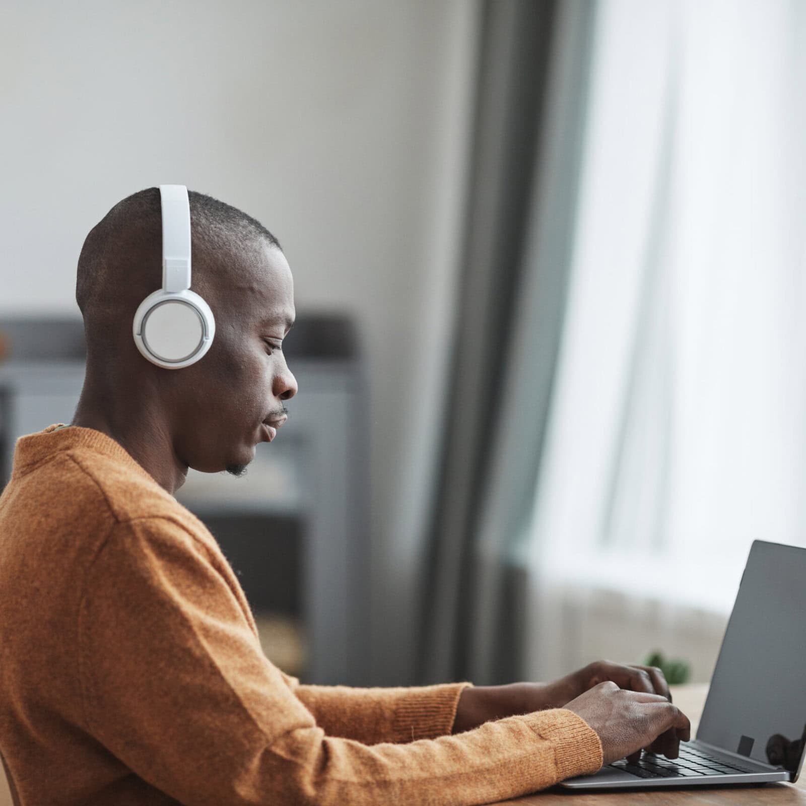African American Man Working from Home Coach seeking ICF credential to showcase expertise and professionalism.