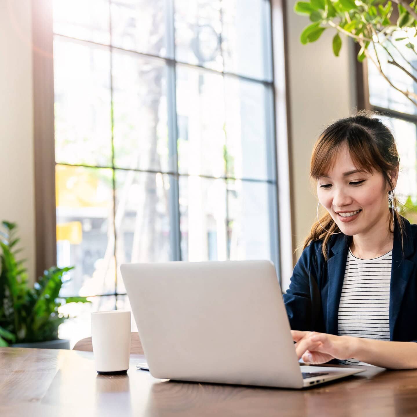 Portrait smile beautiful business asian woman in pink suit worki ICF credentialing exam preparation logo for ACC, PCC, and MCC certifications.