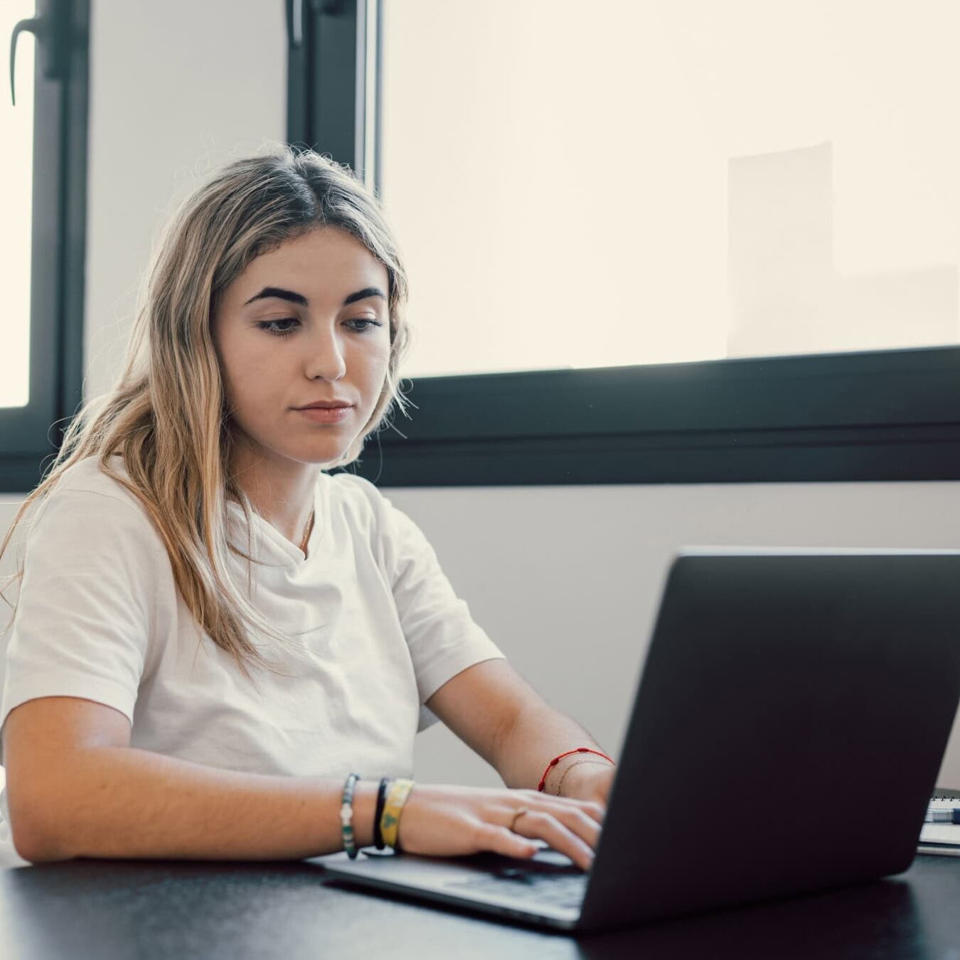 icf-credentialing-remote-credentialing-examination Woman takes her ICF Credential exam remotely.