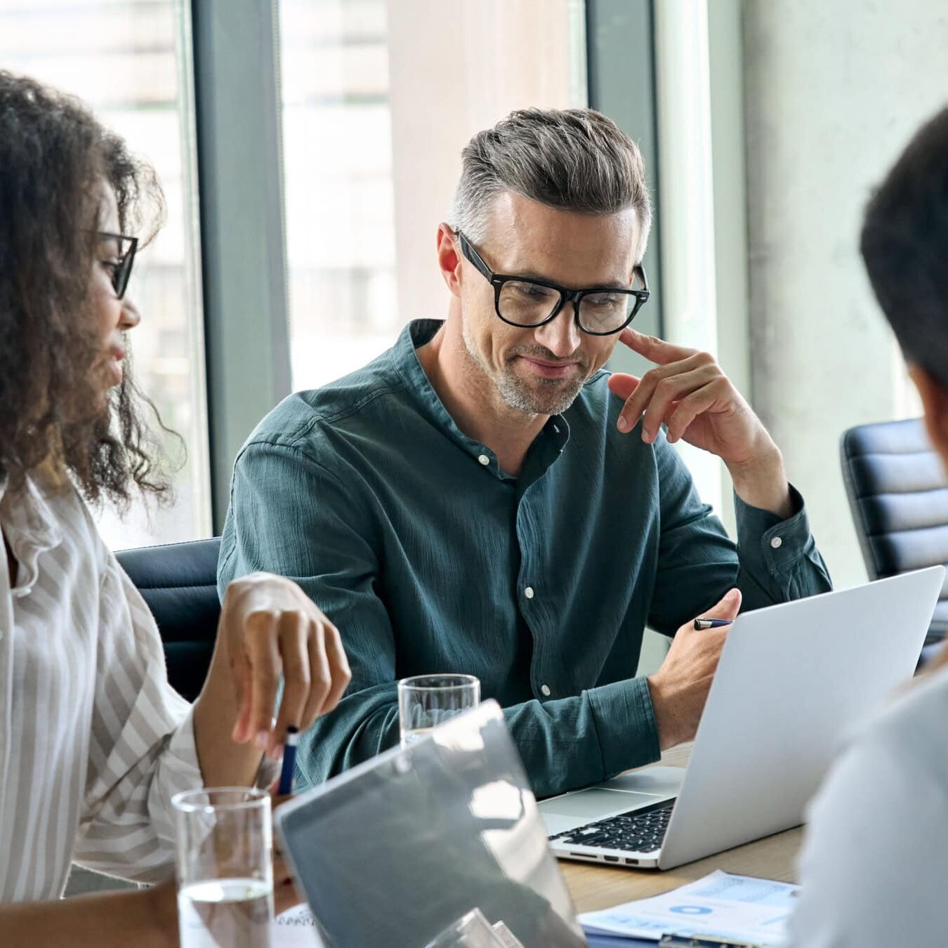A group of professional review the ICF Resources for credential applications.