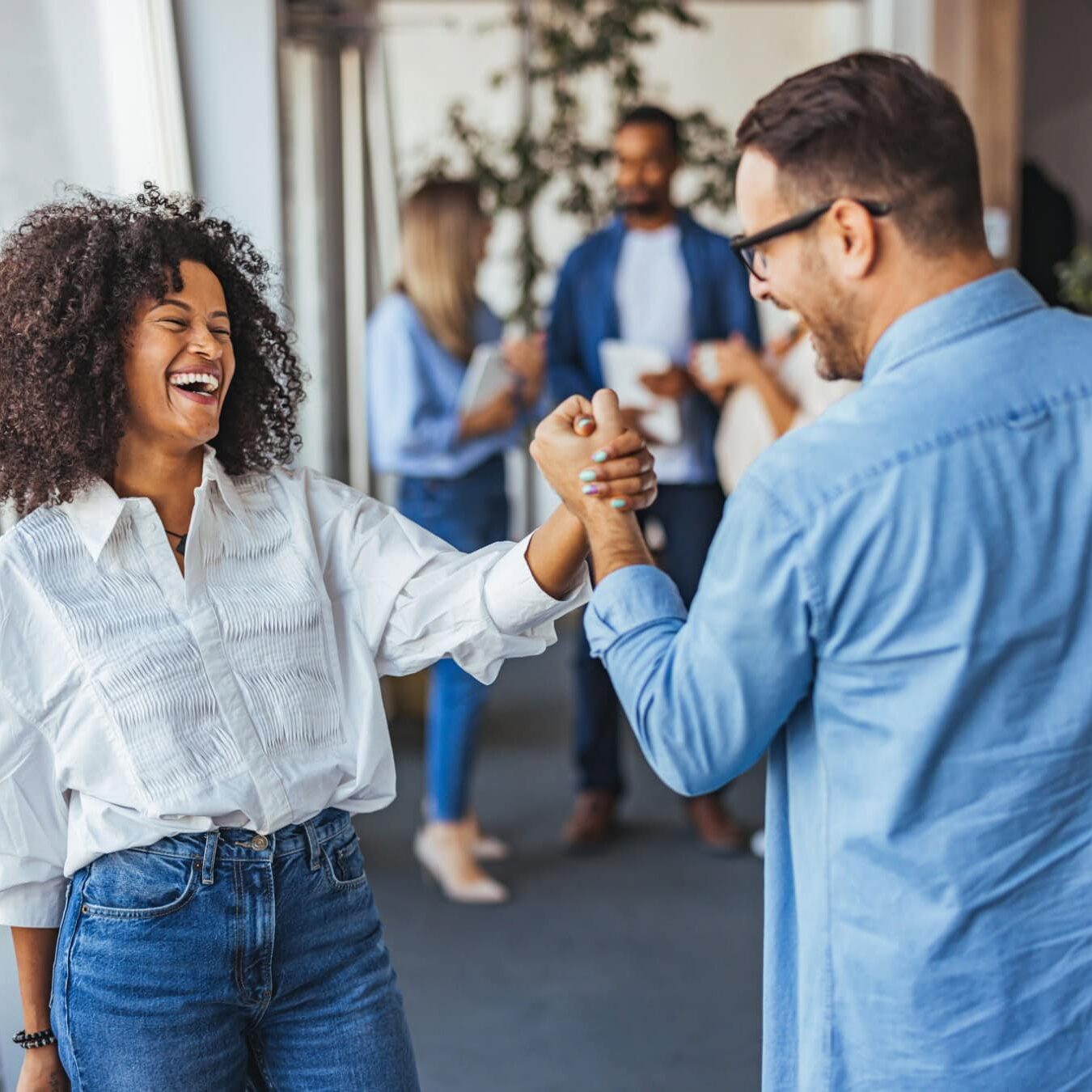icf-credentialing-resources-to-grow A man and a woman shake hands celebrating all of the Credentialing Resources.