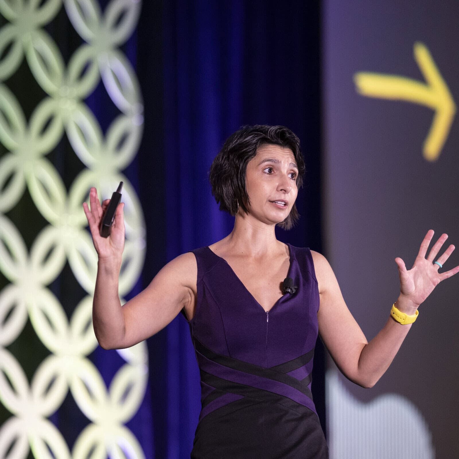icf-event-speaker-opening-remarks Keynote speaker presenting on stage at an ICF Conference, discussing the future of coaching.