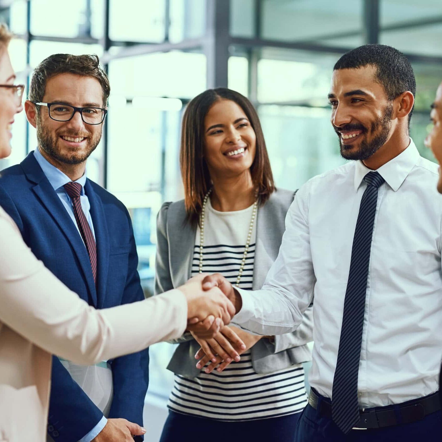 Group,,Business,People,And,Handshake,For,Welcome,,Introduction,Or,Greeting people standing in a circle shaking hands in meeting